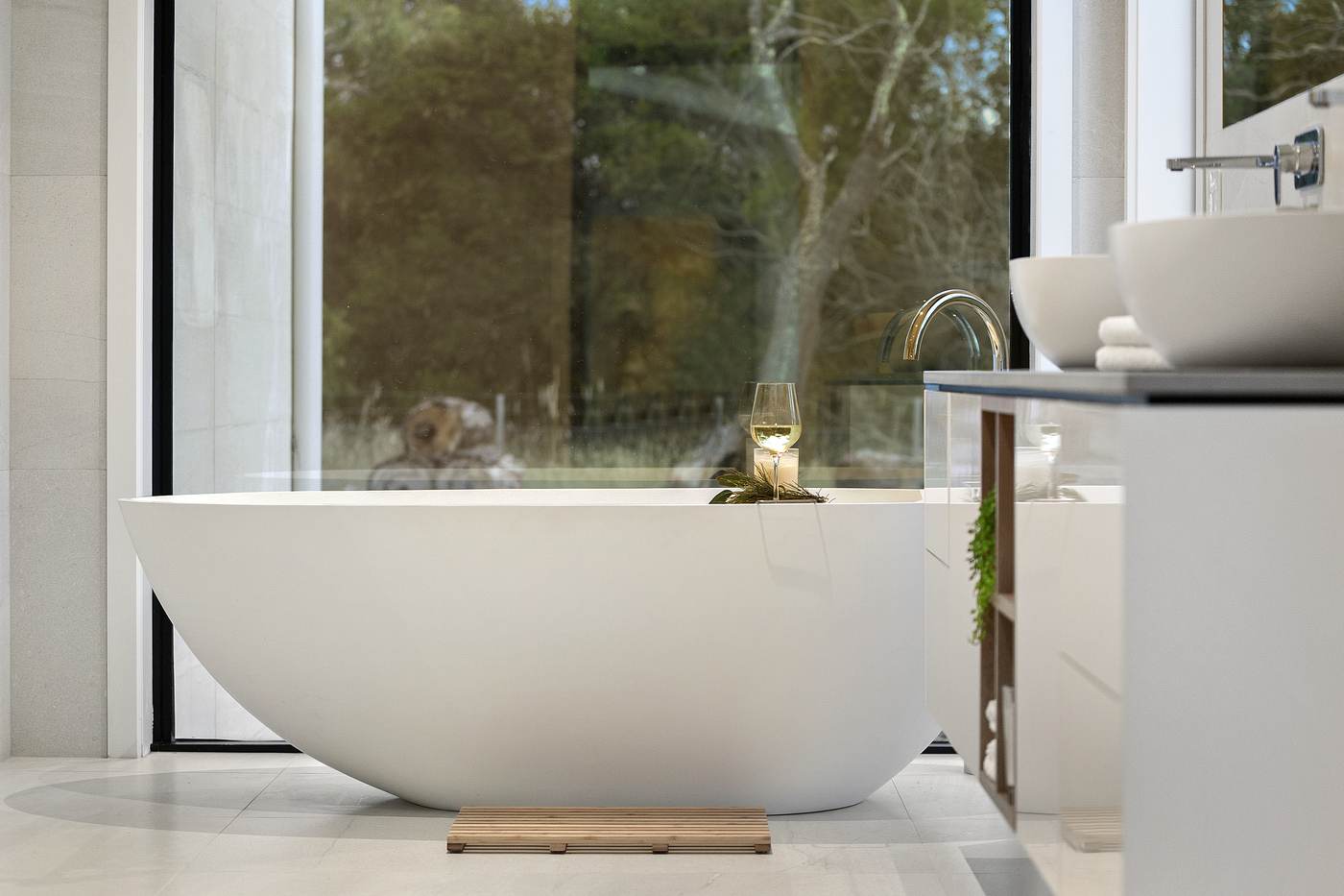 Custom freestanding bathtub in renovated bathroom