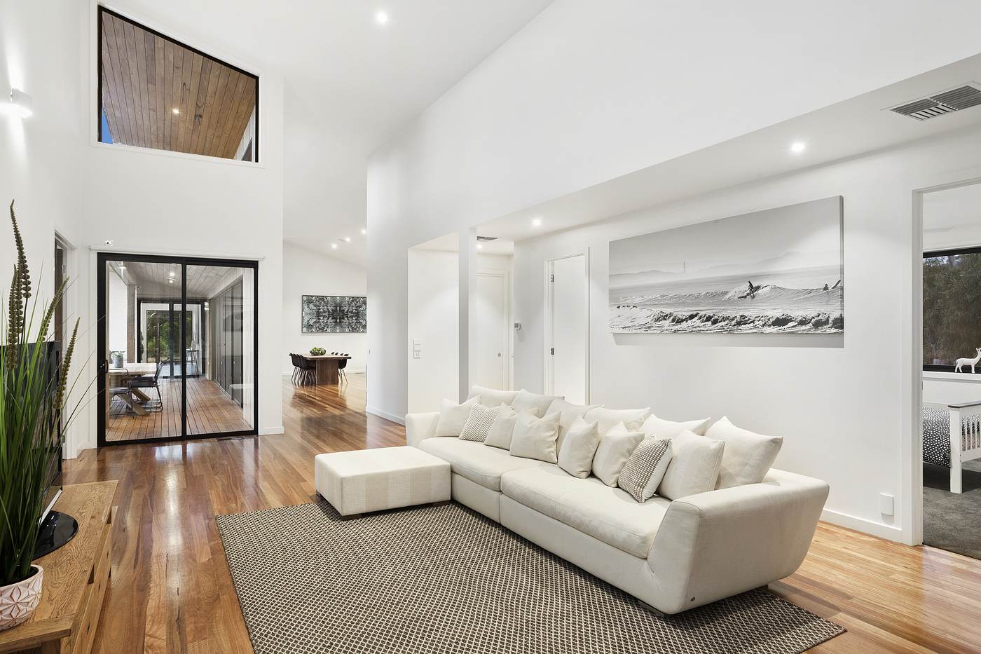 Open-plan living room renovation with polished timber floors